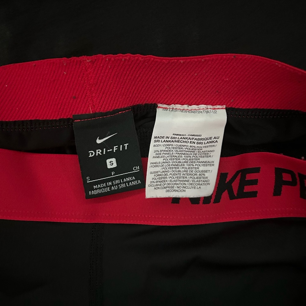 Black Nike pros with red detailing